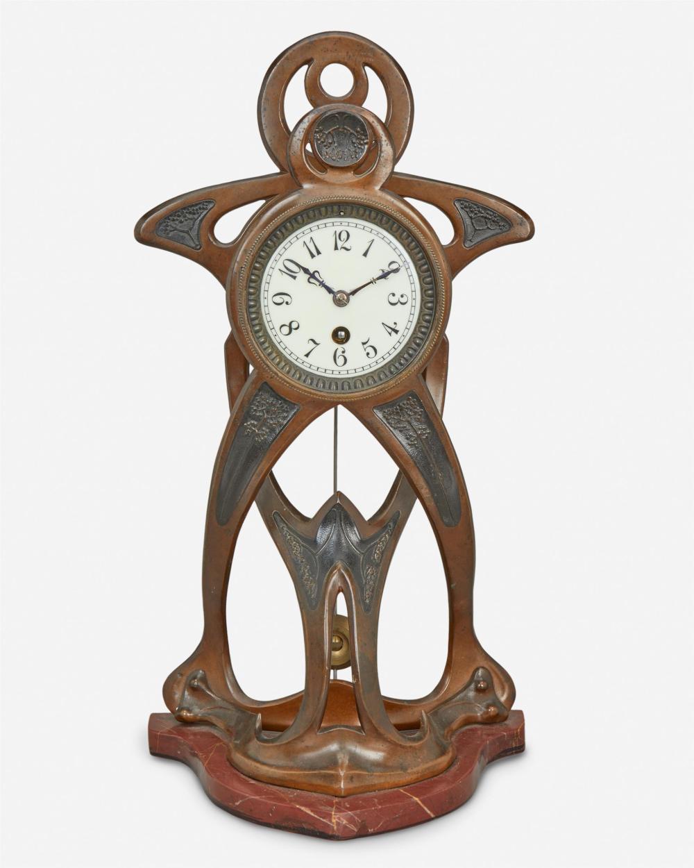 Appraisal: An Art Nouveau patinated metal clock Late th early th