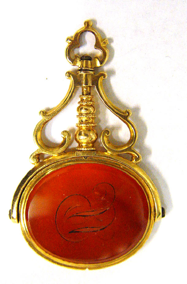 Appraisal: Victorian unmarked gold hardstone spinner with Intaglio carved crest