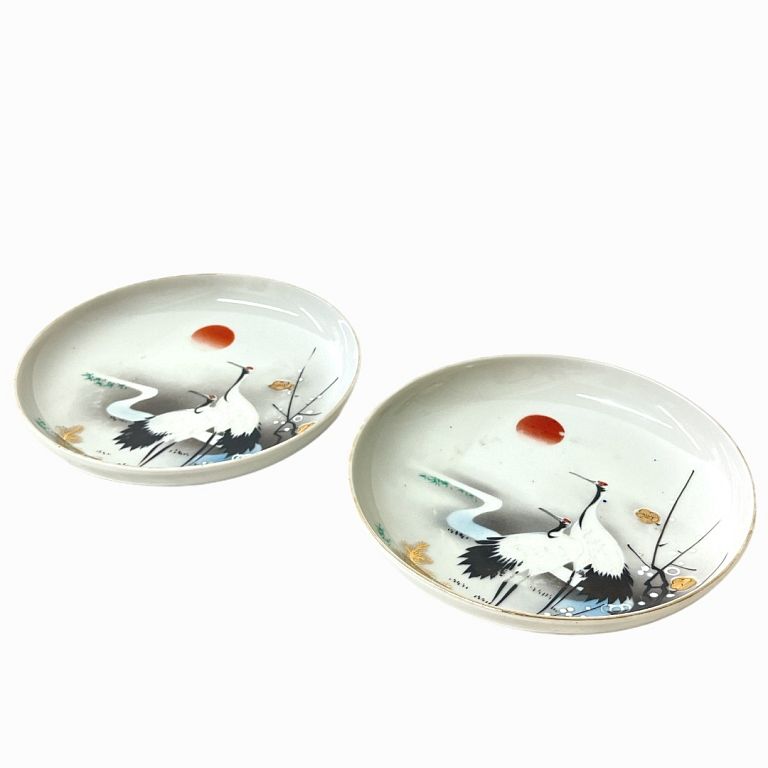 Appraisal: Two Chinese Porcelain Plates Hand painted porcelain with herons and