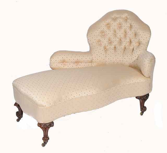 Appraisal: A VICTORIAN BUTTONED AND UPHOLSTERED ROSEWOOD CHAISE LONGUE with a