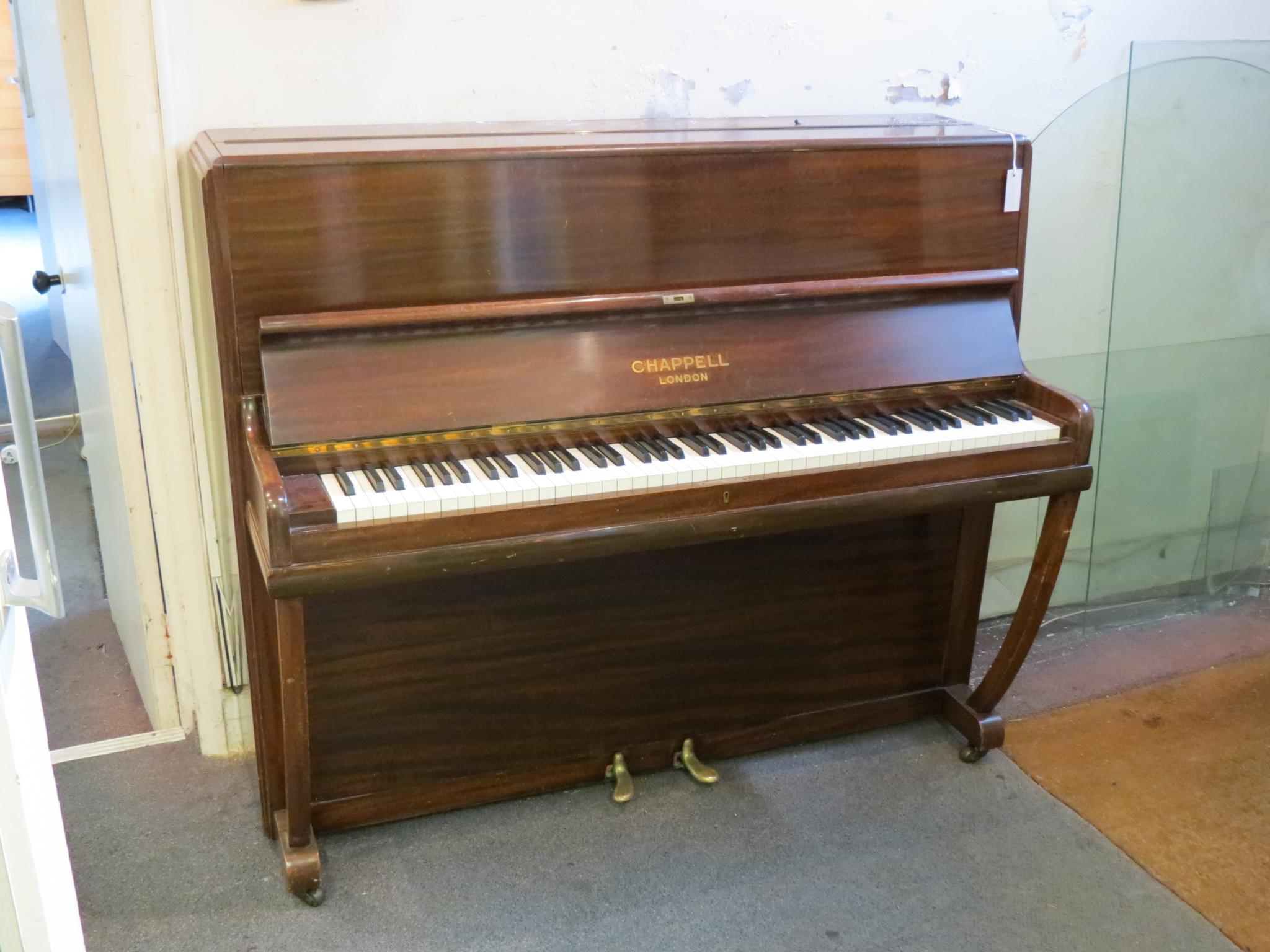 Appraisal: A Chappell upright piano seven-octave keyboard over-strung iron frame in