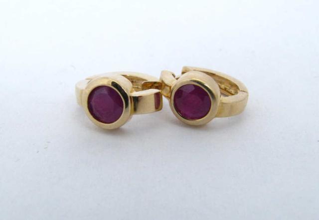 Appraisal: k yellow gold ruby huggie earrings Each earring contains approx