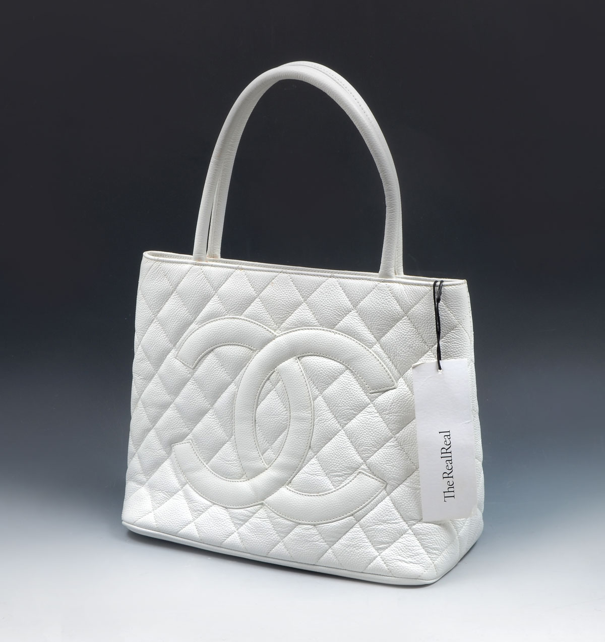 Appraisal: CHANEL WHITE CAVIAR MEDALLION TOTE Chanel Caviar Medallion Tote is