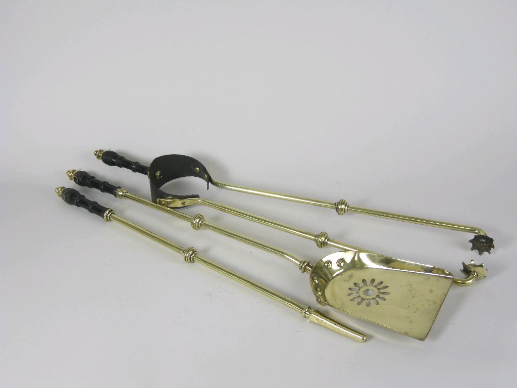 Appraisal: A Set of brass and ebony Arts Crafts Fire Tools