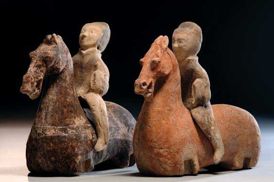 Appraisal: PAIR HAN POTTERY HORSES AND RIDERS Pair of large and