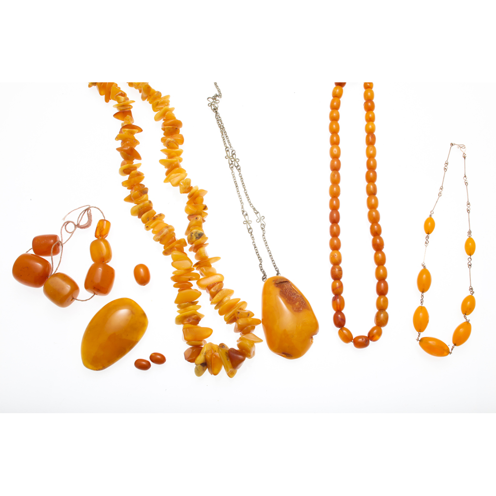 Appraisal: A collection of amber jewellery to include a single strand