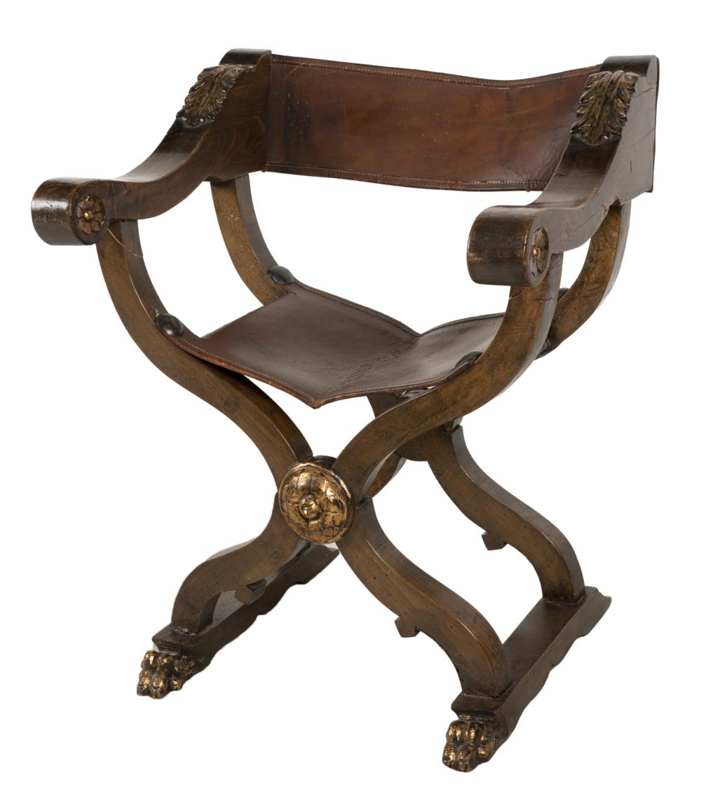 Appraisal: CARVED WALNUT LEATHER SAVONAROLA CHAIRwith gilt accents Condition cracks to