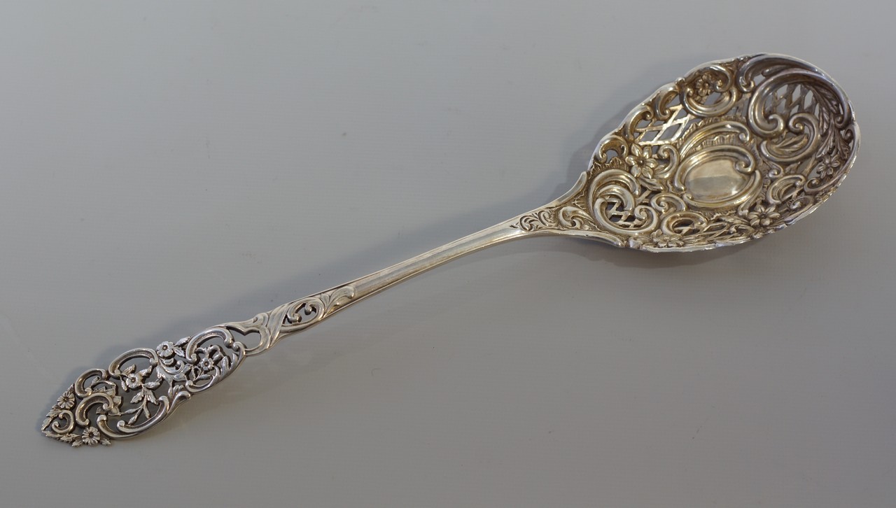 Appraisal: English Victorian sterling silver pierced floral pattern berry serving spoon