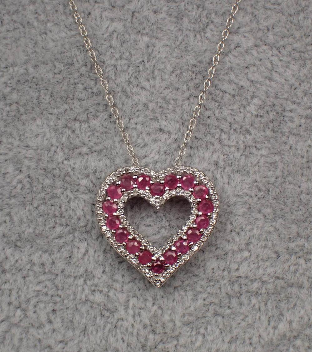 Appraisal: RUBY DIAMOND AND WHITE GOLD PENDANT NECKLACE with an dainty