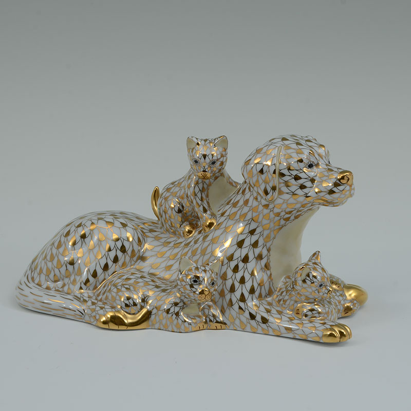 Appraisal: HEREND GOLD FISHNET DOG AND CATS FIGURAL GROUP Limited edition