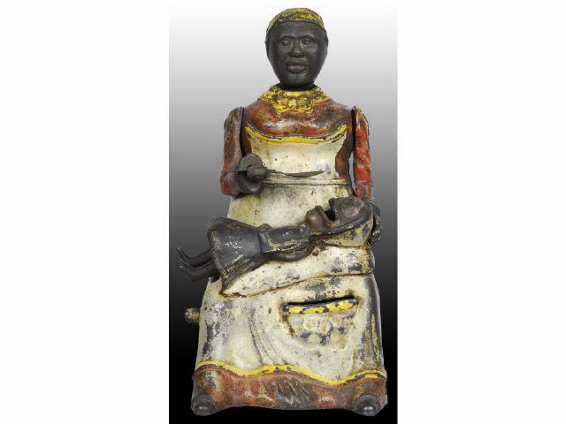 Appraisal: Cast Iron Mammy and Child Mechanical Bank Description Replaced spoon