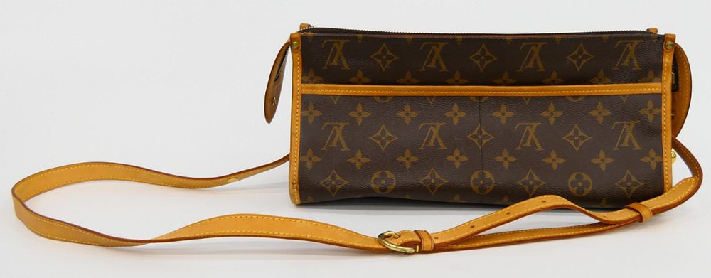 Appraisal: LOUIS VUITTON MONOGRAMED LEATHER BAG WITH STRAP Louis Vuitton brown