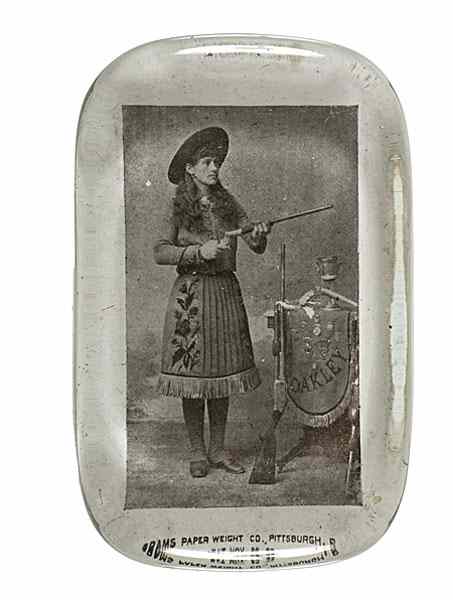 Appraisal: Annie Oakley Paperweight Image under glass depicting Annie Oakley standing