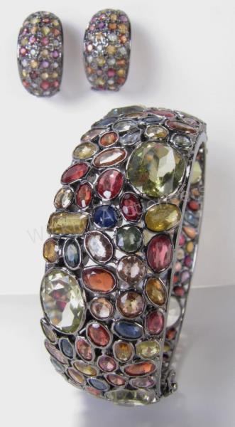 Appraisal: A pair of sterling silver earrings encrusted with multiple colored