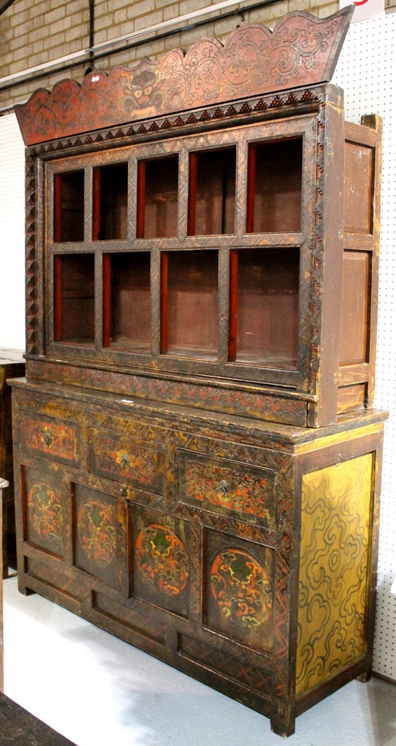 Appraisal: A large Eastern painted and red lacquered deity cabinet with