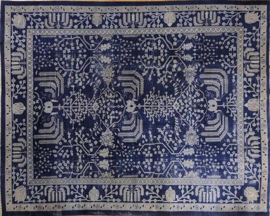 Appraisal: CHINESE WOOLWORK COBALT BLUE-GROUND CARPET The field worked with stylized