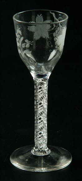 Appraisal: An engraved airtwist wine glass the ogee bowl decorated with