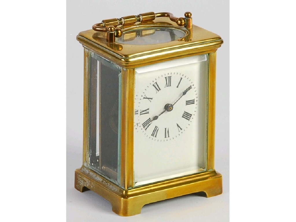 Appraisal: EARLY TWENTIETH CENTURY FRENCH BRASS CARRIAGE CLOCK with enamelled Roman