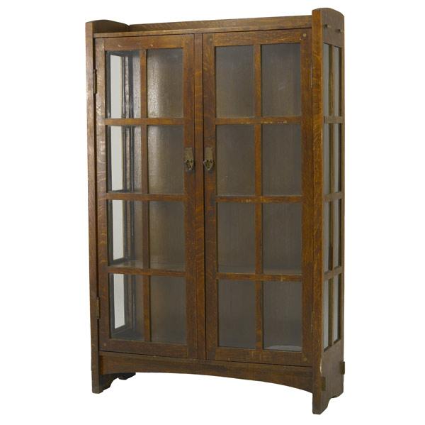 Appraisal: ARTS CRAFTS Two-door china cabinet in the style of Gustav