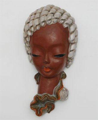 Appraisal: A Goldscheider bust of a woman model glazed in colours