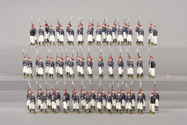 Appraisal: Lot of metal figures representing French Zouaves marching with officers