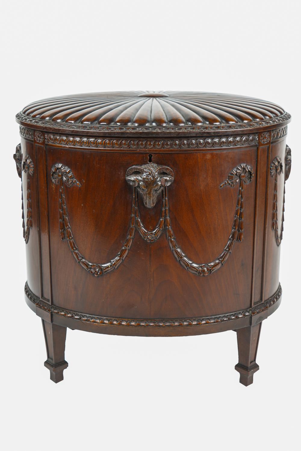 Appraisal: GEORGIAN STYLE MAHOGANY CELLAREToval with hinged lid decorated with ram's