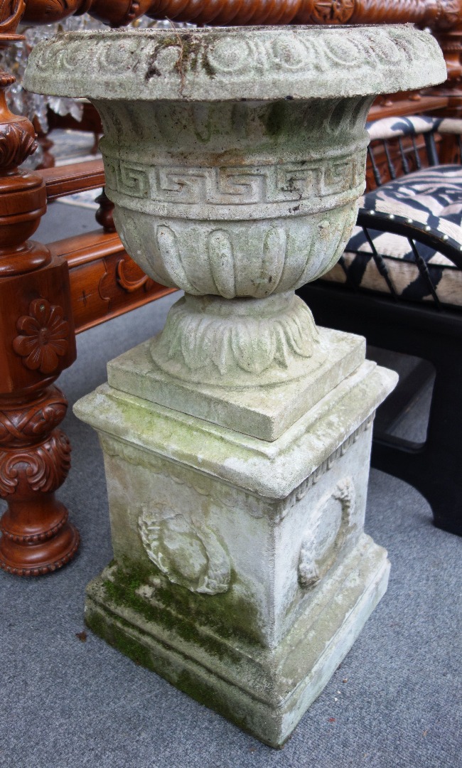 Appraisal: A pair of composition stone garden urns with Greek key