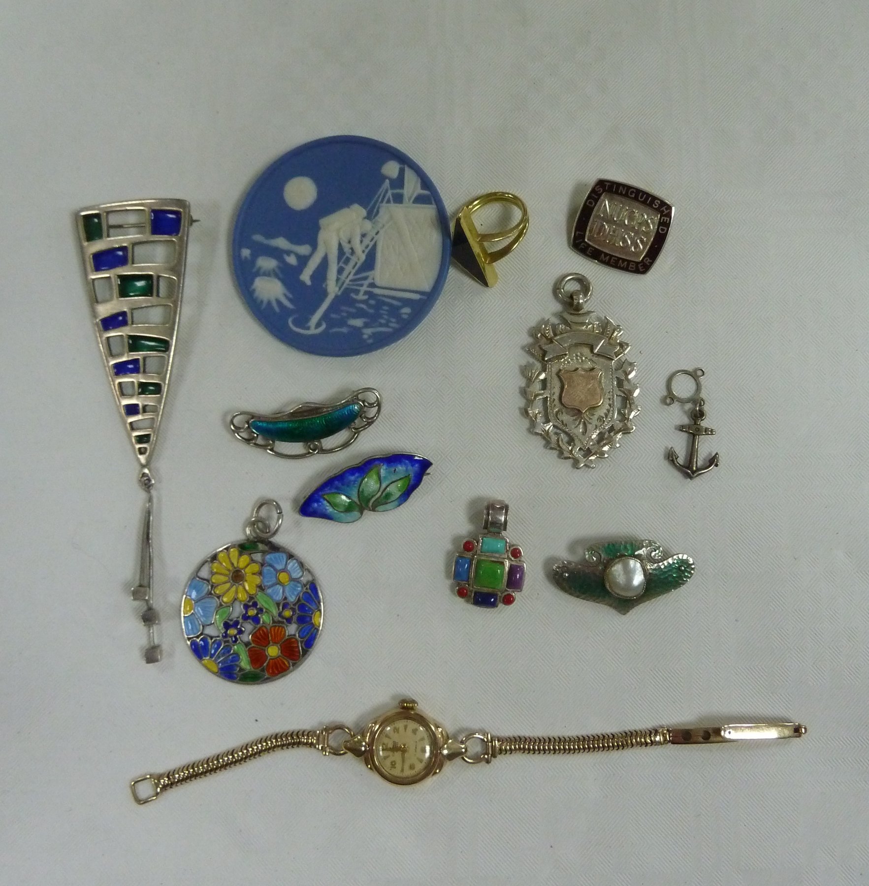 Appraisal: Three silver and enamel brooches a ct gold wristwatch on