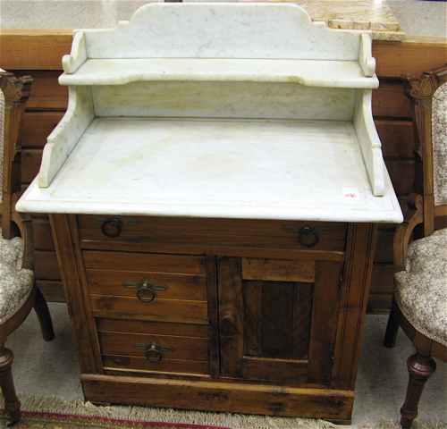 Appraisal: VICTORIAN MARBLE-TOPPED WASHSTAND American late th century having a rectangular