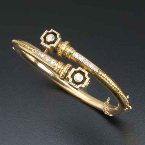 Appraisal: Etruscan Revival style gold and diamond hinged bypass bangle in