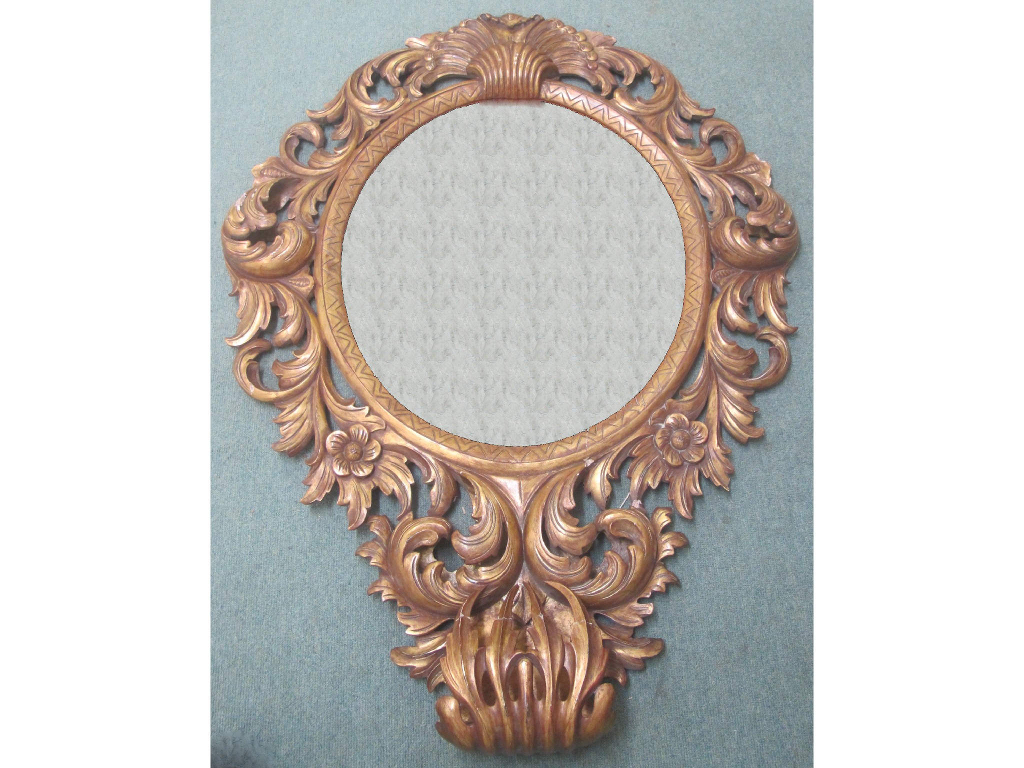 Appraisal: A large wall mirror with floral carving