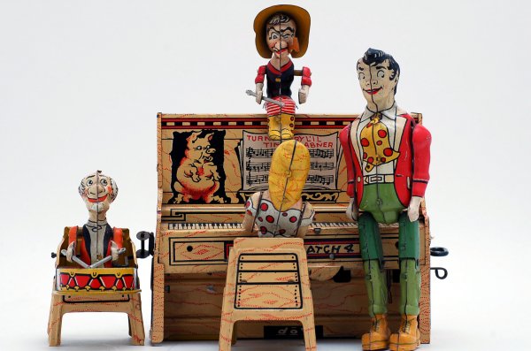 Appraisal: Lil' Abner His Dogpatch Band tin lithographed wind-up toy patent