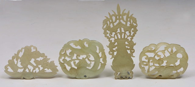 Appraisal: A PAIR OF WHITE JADE APPLIQUES pierced and carved as