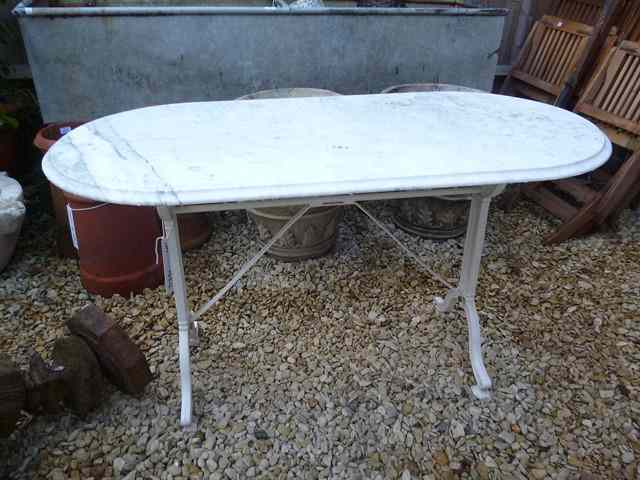 Appraisal: A WHITE MARBLE GARDEN TABLE on a painted stand with