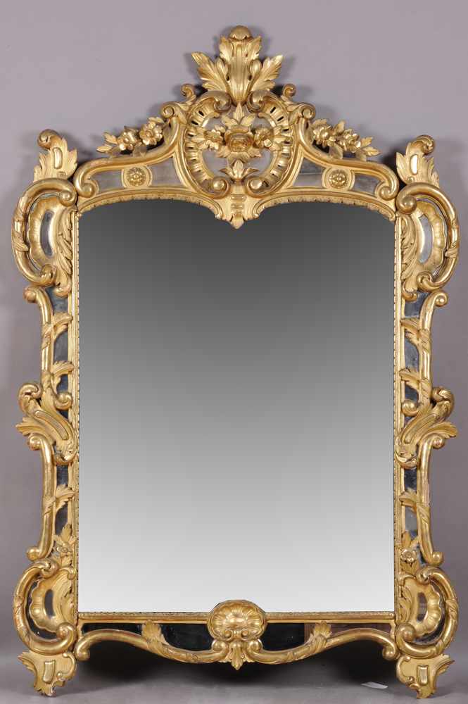 Appraisal: LOUIS XV STYLE GILTWOOD MIRROR The cartouche-shaped mirror plate within