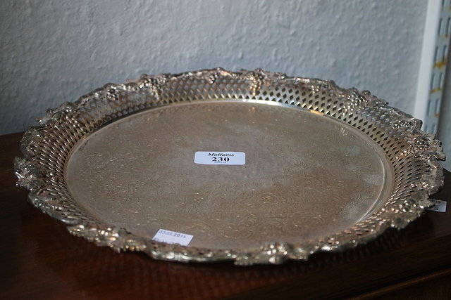 Appraisal: A SILVER PLATED CIRCULAR SALVER with vine leaf border cm