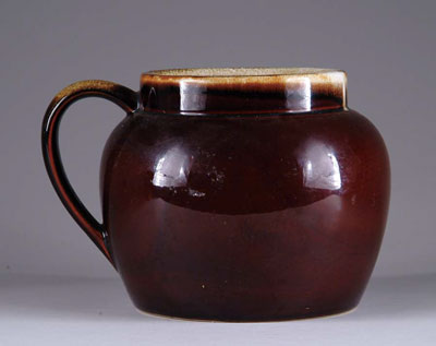 Appraisal: CERAMIC BEAN POT Brown glazed handled bean pot marked Pfaltzgraff