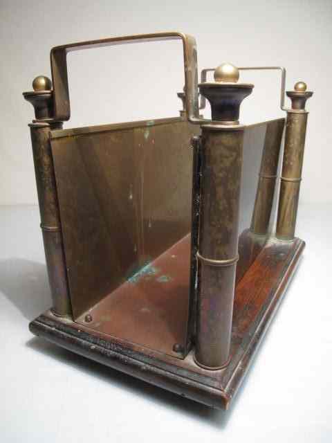 Appraisal: An English arts and crafts magazine rack Heavy brass and