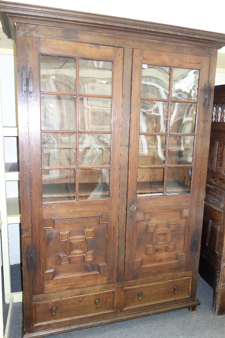 Appraisal: An early th century and later pine and oak cupboard