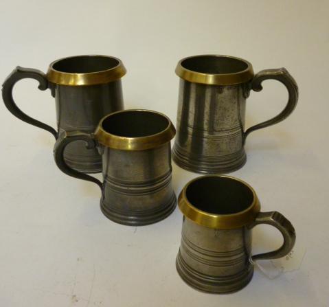 Appraisal: A MATCHED SET OF THREE PEWTER MEASURES th century of