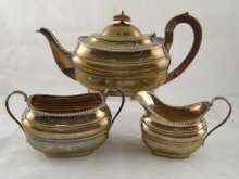 Appraisal: A three piece silver barge shaped teaset with gadrooned rims