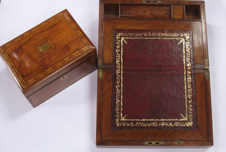 Appraisal: A VICTORIAN WALNUT AND BRASS BOUND WRITING SLOPE the rectangular