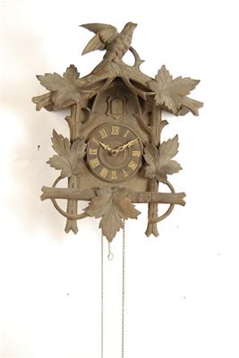 Appraisal: A Black Forest carved and stained wood cuckoo clock with