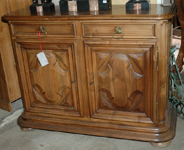 Appraisal: A FRENCH WALNUT BUFFET The rounded rectangular top above two