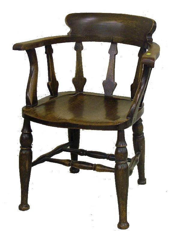 Appraisal: Early th century oak smoker's bow armchair with stylised splats