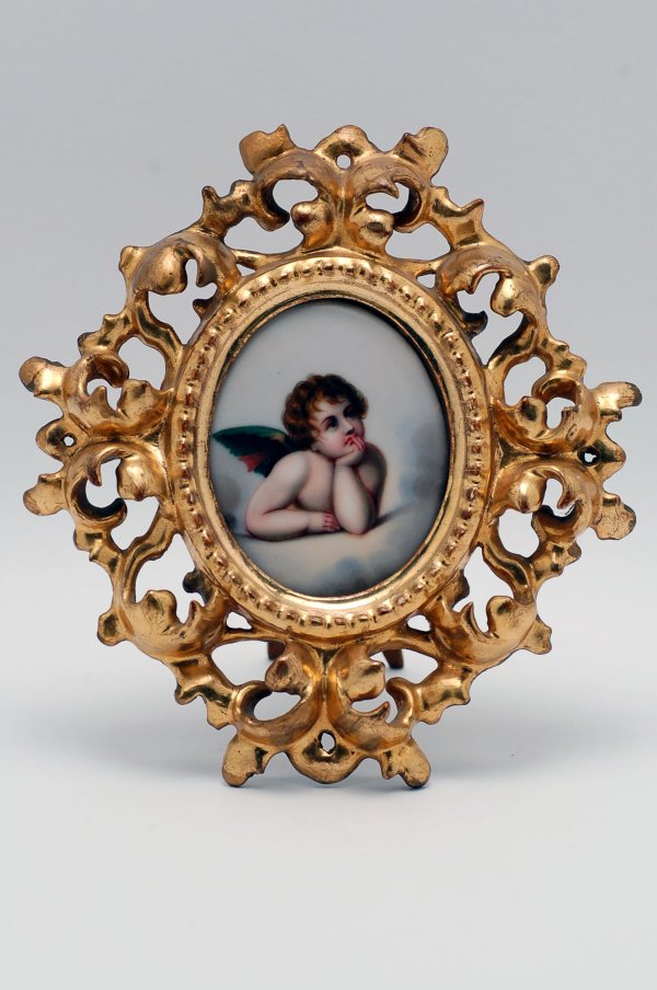 Appraisal: th century handpainted porcelain unsigned image of a contemplative cherub