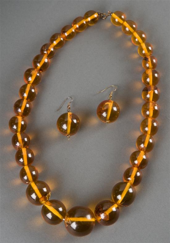 Appraisal: Amber beaded necklace with matching earrings th century Translucent honey