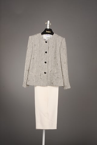 Appraisal: Andr Laug black off-white slacks suit with bow and sparkly