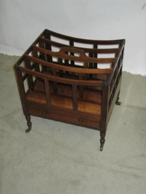 Appraisal: A VICTORIAN ROSEWOOD CANTERBURY of dished oblong form with loop