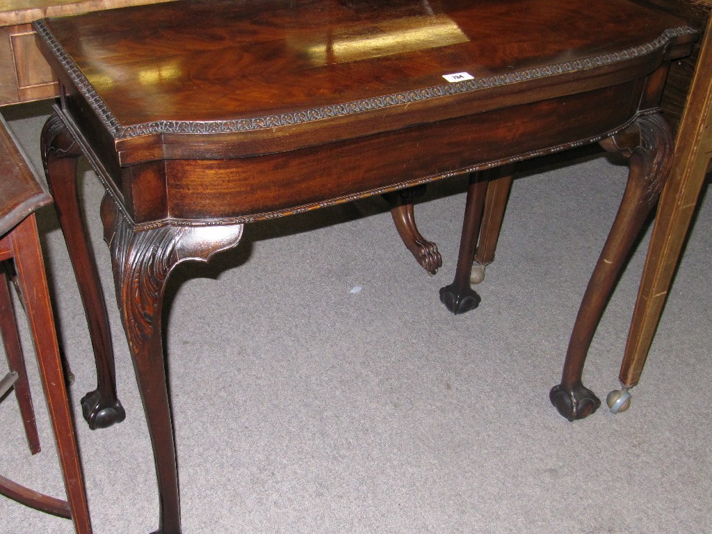 Appraisal: Mahogany turnover card table on ball and claw feet